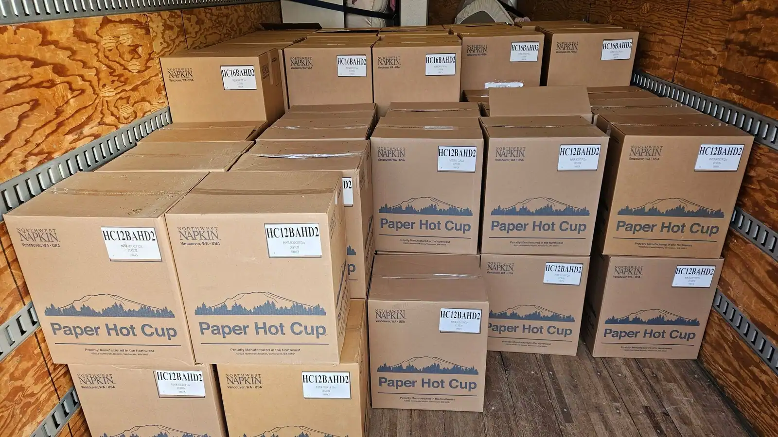 Cases of boxed paper cups loaded in a box truck