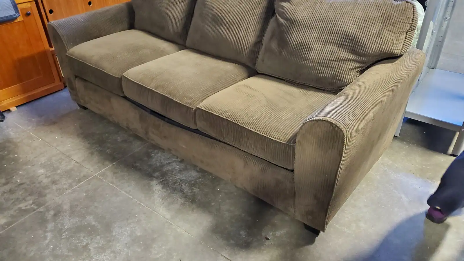 An old green fabric couch