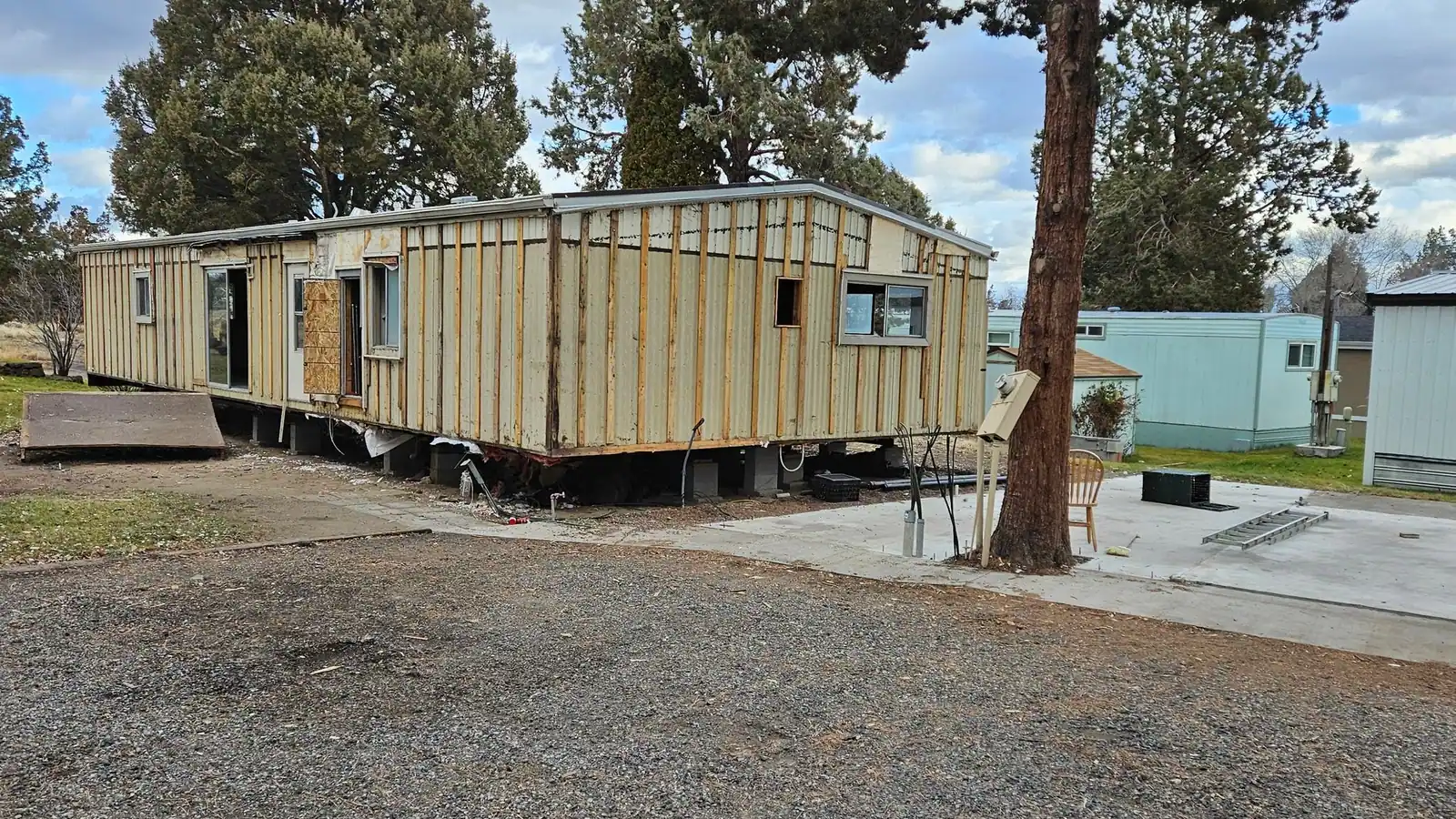 An old manufactured home stripped down to its wall framing