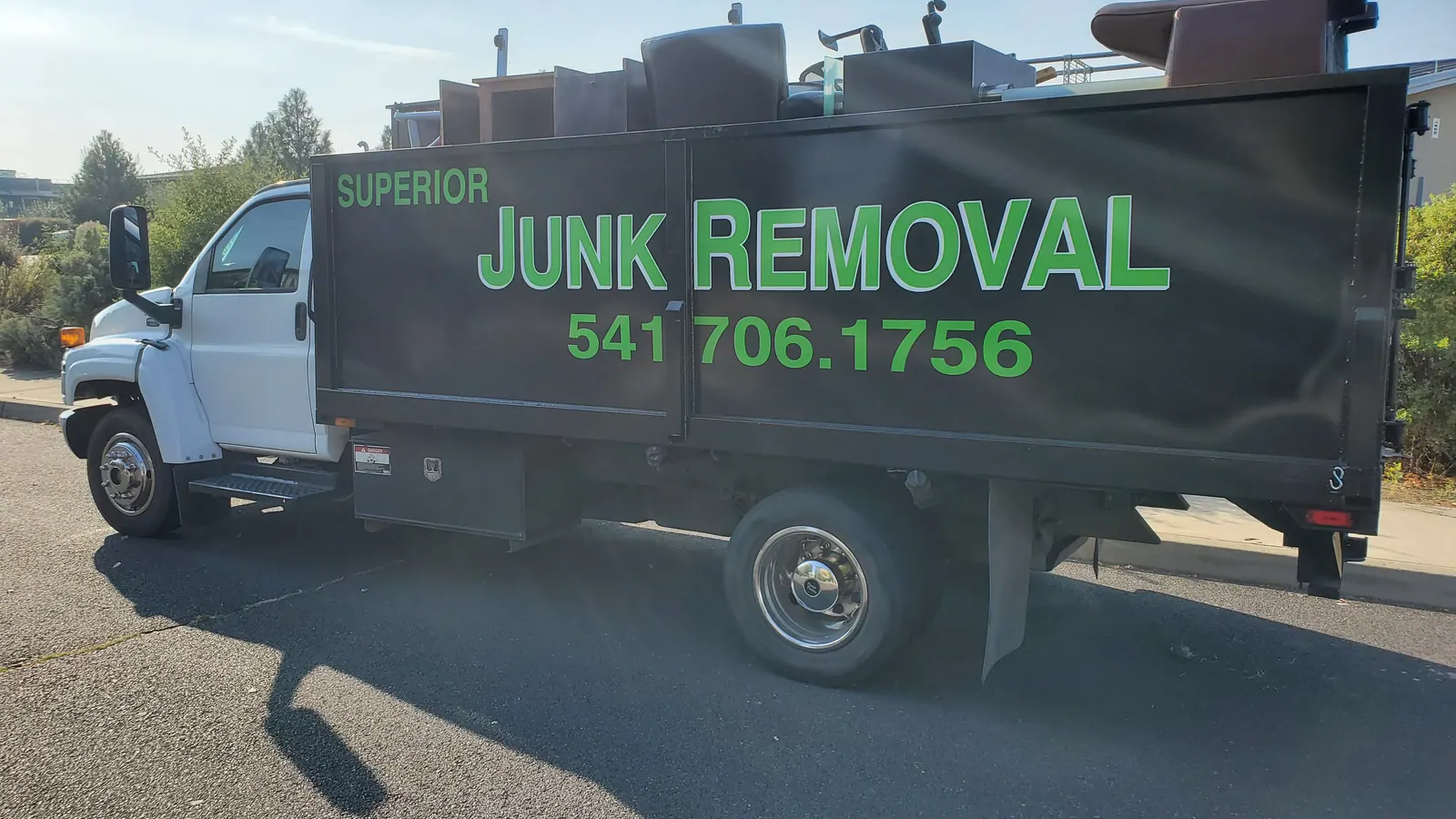 The Superior Junk Removal dump truck loaded with furniture